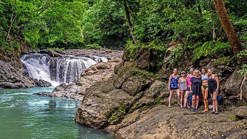 Students exploring a waterfall